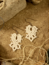 Close-up showing fine lacework and loops of the Wingroot design.