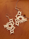 Lightweight lace earrings inspired by wind and motion.