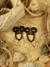 Lightweight lace earrings with dramatic double arches.