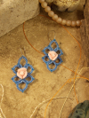 Wanderbloom Trefoil earings displayed on natrual stone.