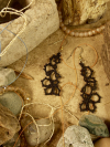 Black nylon earrings looped in bold Wanderthread style.