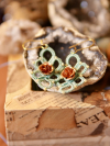 Handmade lace earrings with trefoil pattern and copper roses.