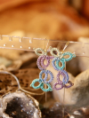 Geometric lace earrings with three descending motifs