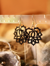 Pineapple lace earrings paired with rustic textures and natural light