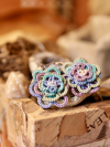 Threaded Bloom earrins with pastel spirals and beaded centers.