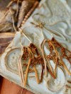 Wanderthread lace earrings with golden brown leather