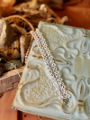 Snowmelt Whisper Tatted Lace Bracelet on bohemian backdrop