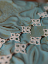 Lightweight artisan lace necklace inspired by journeys and crossroads.