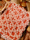 Hand-tatted white lace purse made from soft peach silk.