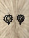 Silver cross charm earrings crafted in black tatted lace.