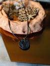 Black clay necklace with silver flecks