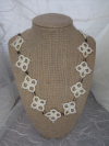 The Pathwoven necklace showing its repeating pattern of lace and glass beads.