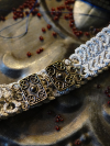 close-up of Celtic clasp on storm-gray tatted lace choker