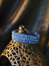 Side view of blue tatted bracelet