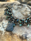 Tatted necklace with lava stone focal and green serpentine beads
