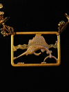 Close-up of Sailfish Pendant in Deep Line Drift Sailfish focal framed in patinaed brass rectangle