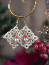 Christmas lace earrings featuring detailed tatting and seasonal Santa bead charm