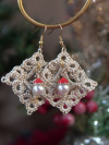 Intricate diamond lace earrings with pearl and Santa hat beads shown in festive