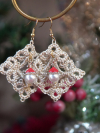 Holiday earrings with lace diamonds and whimsical Santa hat beads photographed n