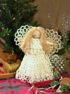 Holiday tree topper angel with white tatted lace gown and wings
