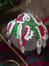 Hand-tatted Christmas lace bauble in festive colors