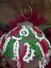 Tatted red, green, and white ornament with crystal bead accents