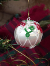 Threadmarked satin ornament featuring intricate needle-tatted lace