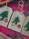Set of three rustic wood tags with green tatted Christmas tree motifs