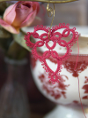 Red lace heart shown among vintage-style props