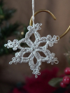 Hand-tatted small silver snowflake ornament with lace loops