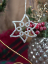 Silver lace snowflake ornament with open pointed design