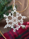 Classic small silver tatted snowflake ornament with looped points