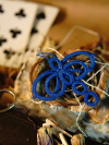 Blue hand tatted dragonfly embellishment on ceramic rose