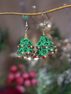 Dimensional lace Christmas tree earrings on gold earring holder