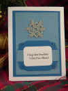 Winter-themed handmade notecard with a tatted snowflake centered on embossed blu