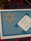 Blue winter notecard featuring an intricate handmade lace snowflake embellishmen