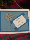 Handcrafted snowflake card with tatted lace motif and winter-inspired embossed b