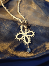 tidecross lace necklace with ocean blue glass bead centerpiece.
