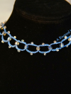 Crystal and sea-glass choker in ocean blue thread.