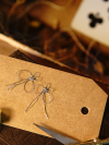 Metallic tatted butterflies on a kraft tag