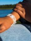 Handmade white lace bracelet Petalbound from the Wanderthread Collection