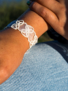 White fiber jewelry bracelet Petalbound in traditional tatting style