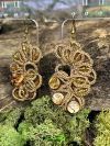 Sunset Glow earrings displayed on moss with driftwood