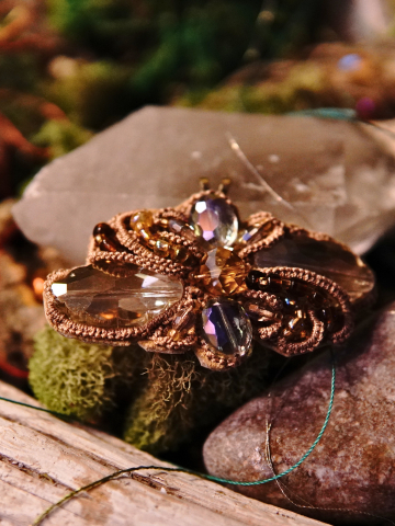 Earthen lace pendant with shimmering crystals