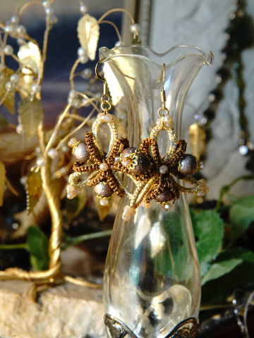 Brown gold handmade earrings shown on Aeluin backdrop