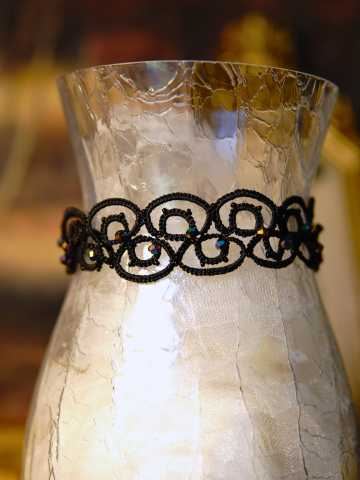 Black tatted choker showing intricate loop pattern