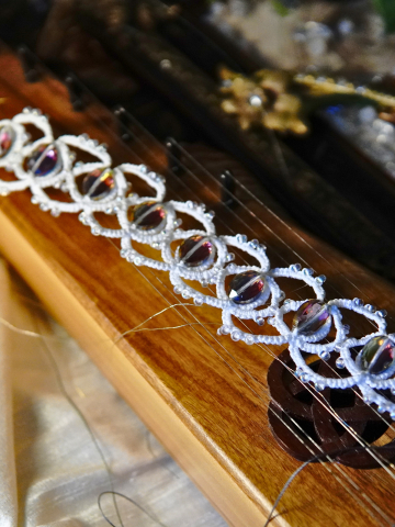 White tatted bracelet with Aurora Borealis crystals