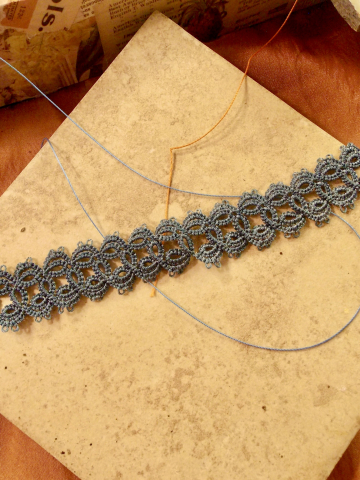 Skythread Tatted Lace Bracelet on warm neutral stone tile