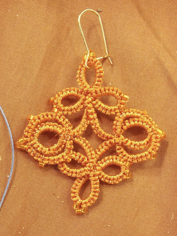 Trellis Dance Tatted Lace Earrings in Terracotta Close-up of handcrafted orange Trellis Dance lace earrings
