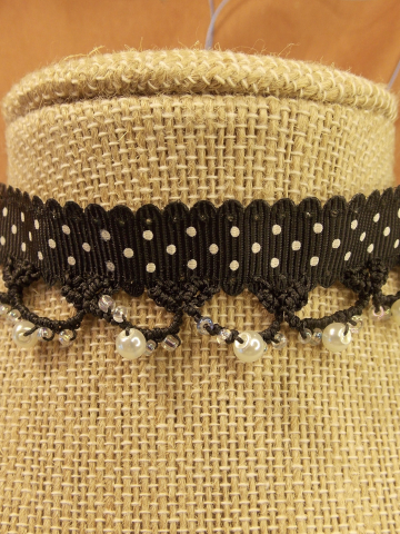 Black lace tatted on polka-dotted black grosgrain ribbon choker.